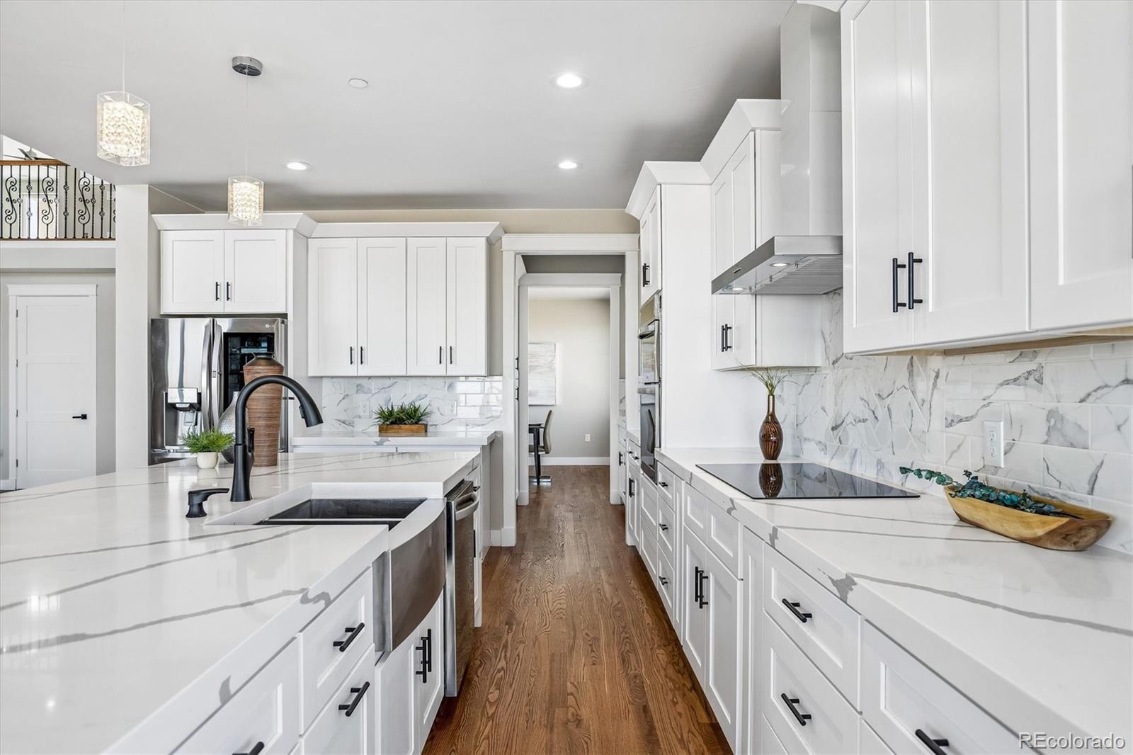 13350 Imboden Road Hudson, CO 80642 - Photo 9 of 50 a kitchen with kitchen island granite countertop a sink a counter top space stainless steel appliances and cabinets