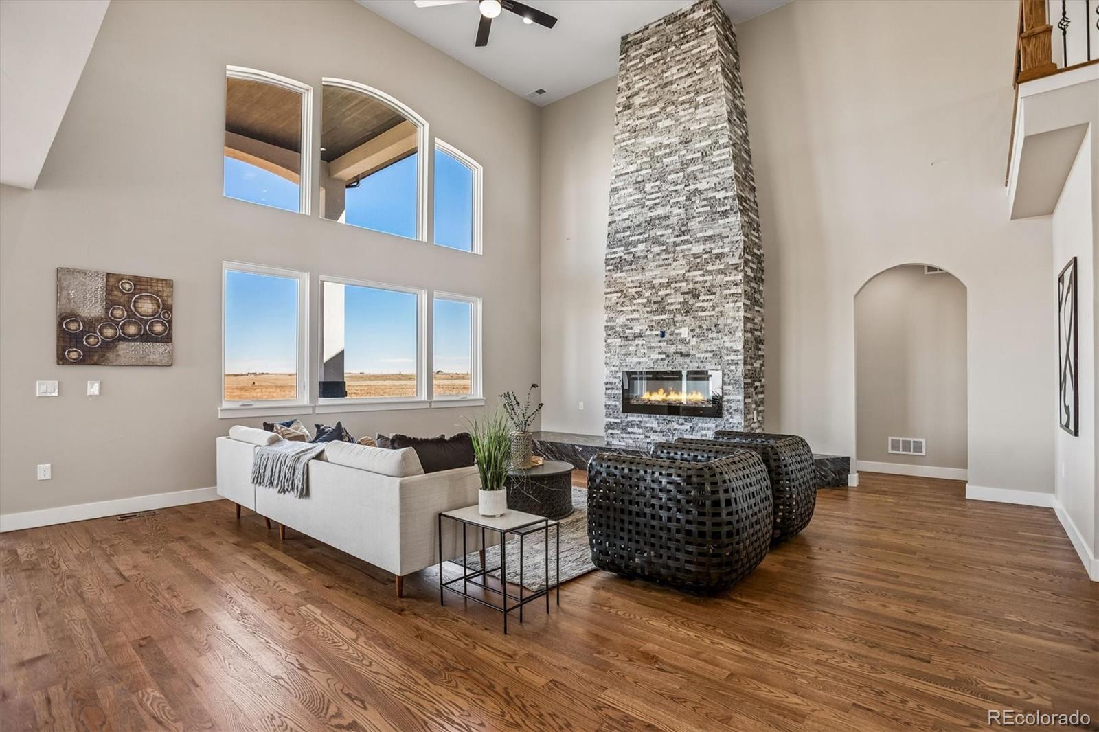 13350 Imboden Road Hudson, CO 80642 - Photo 10 of 50 a living room with furniture and a fireplace