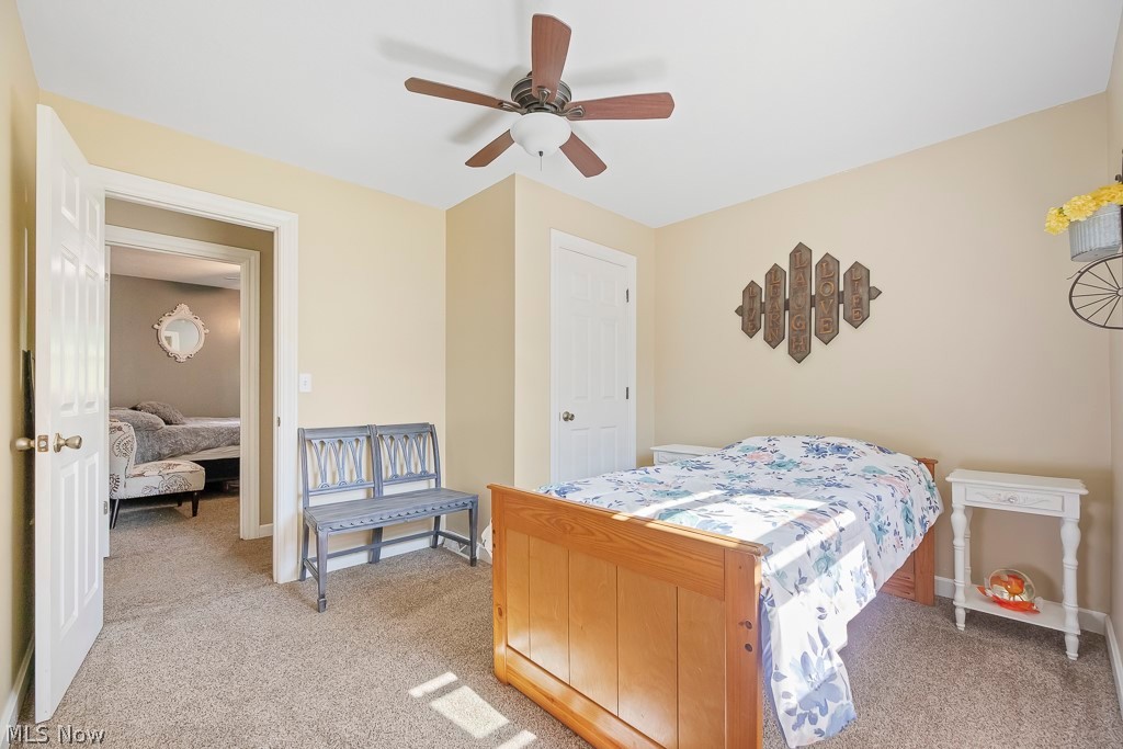2400 Sunnybrook Road Mogadore, OH 44260 - Photo 16 of 50 Carpeted bedroom featuring ceiling fan