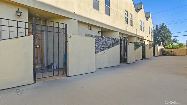 a view of a street with a building in the background