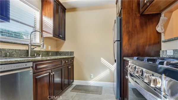 a kitchen with a stove and a sink