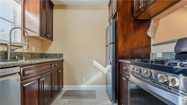 a kitchen with a stove and a sink