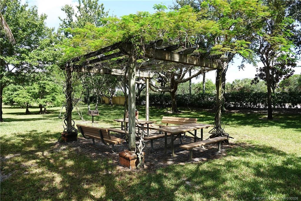 53 Southeast Sedona Circle, Unit 201 Stuart, FL 34994 - Photo 31 of 37 a view of backyard with tree