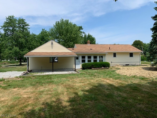 38522 Rogers Road Willoughby, OH 44094 - Photo 2 of 9 Rear view of property featuring a lawn