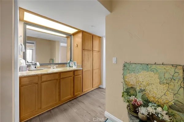 a bathroom with a double vanity sink and a mirror