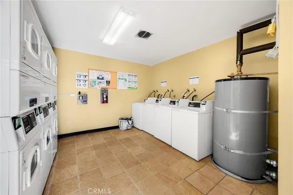 a view of a kitchen with refrigerator and a stove