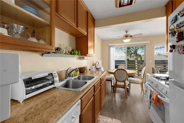 a kitchen with stove and cabinets