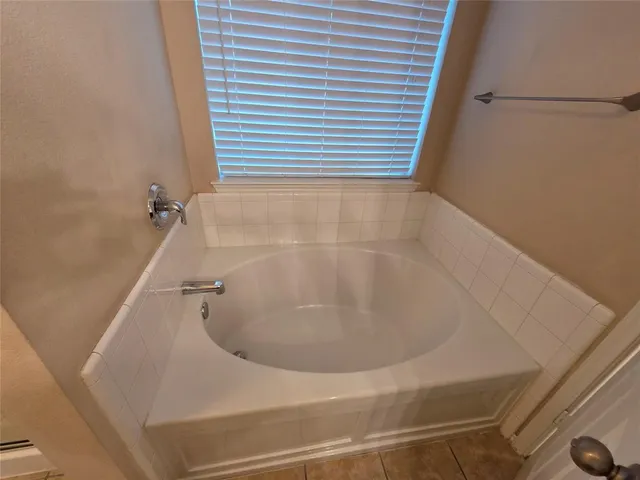 a bathroom with a double vanity sink mirror and toilet