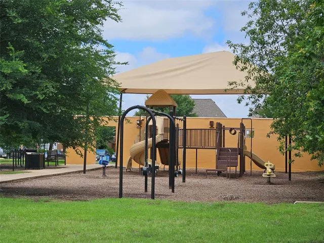a view of a golf course with a ocean view