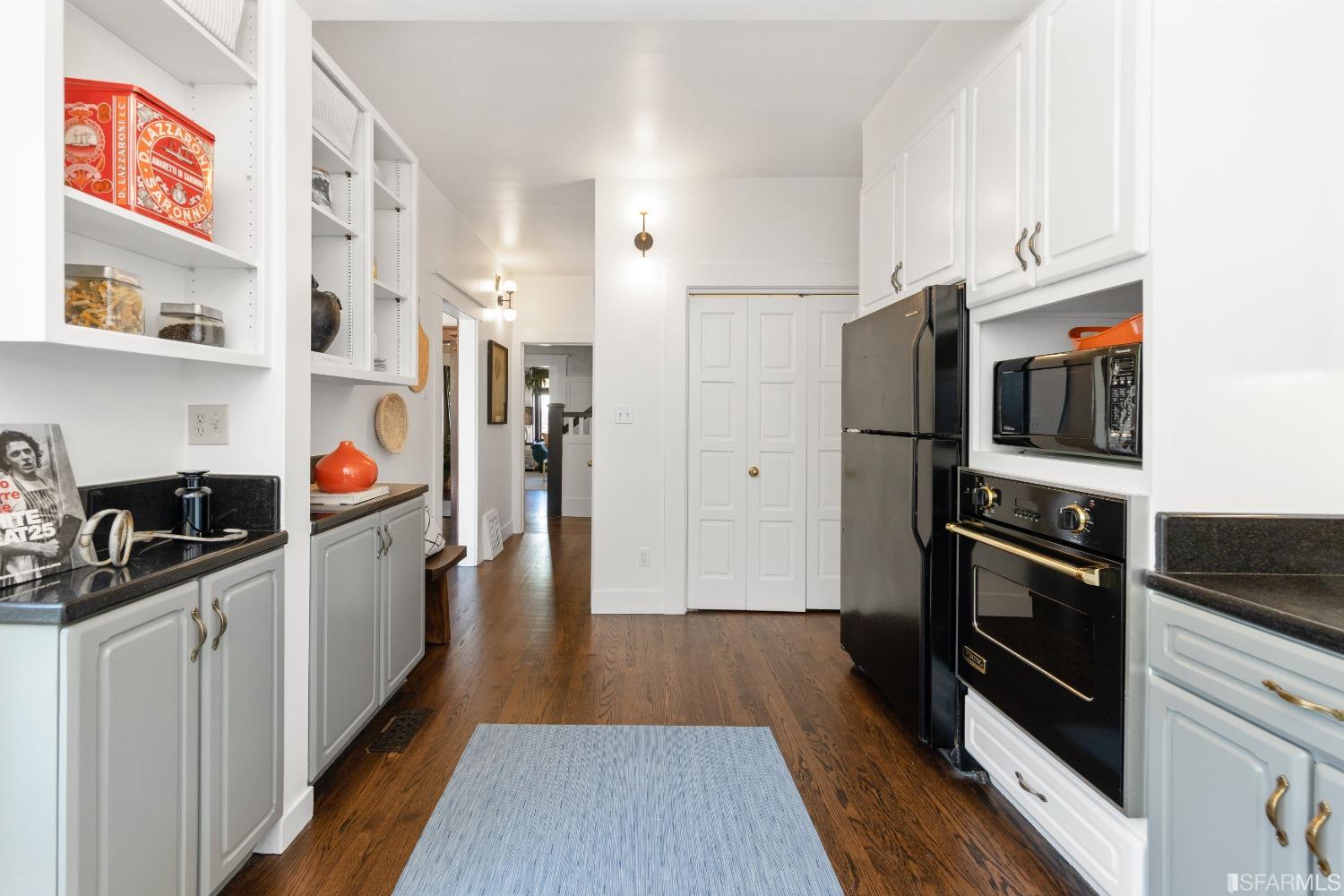6th Avenue San Francisco, CA 94122 - Photo 16 of 72 a kitchen with stainless steel appliances a stove a sink and a refrigerator
