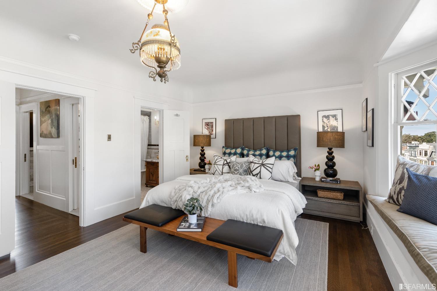 6th Avenue San Francisco, CA 94122 - Photo 22 of 72 a bedroom with a bed and wooden floor