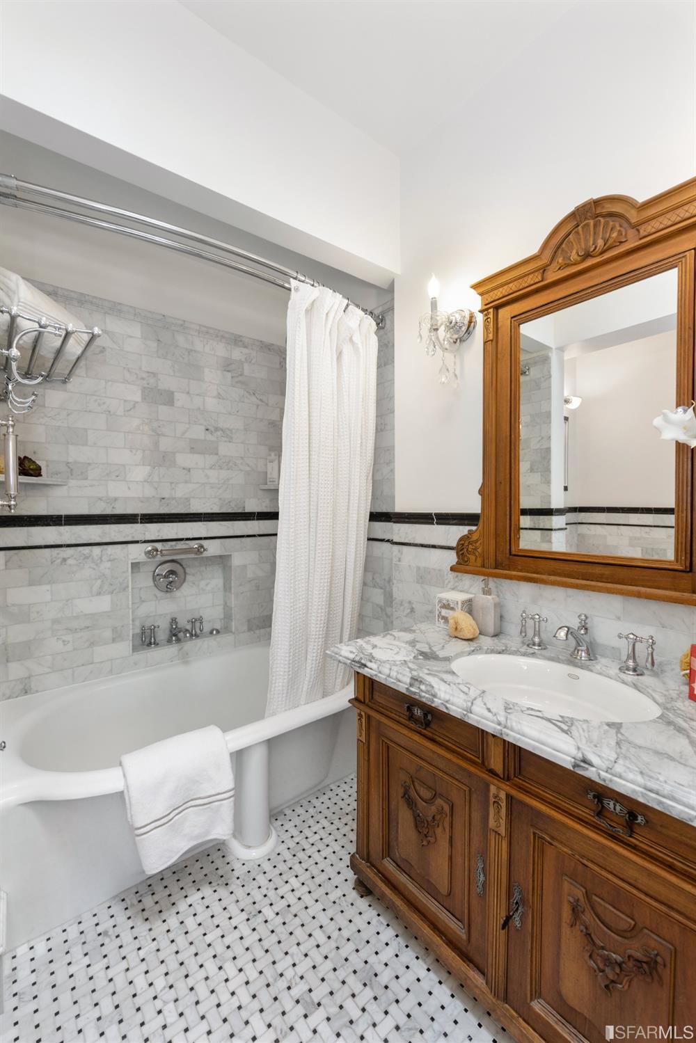6th Avenue San Francisco, CA 94122 - Photo 27 of 72 a bathroom with a granite countertop sink a toilet and a mirror