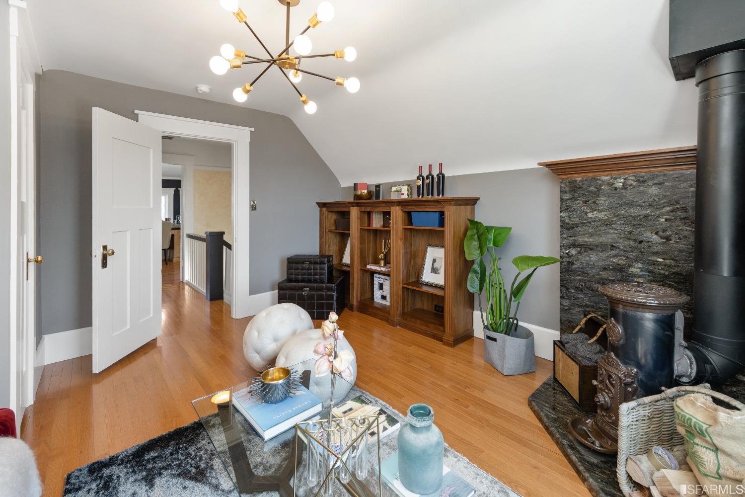 6th Avenue San Francisco, CA 94122 - Photo 47 of 72 a living room with furniture a rug and a chandelier