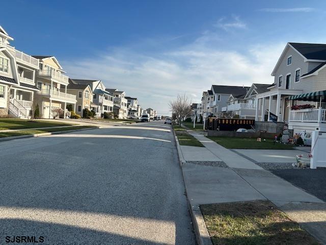 3200 West Brigantine Avenue, Unit 5 Brigantine, NJ 08203 - Photo 2 of 5 a city view with tall buildings and cars parked on road