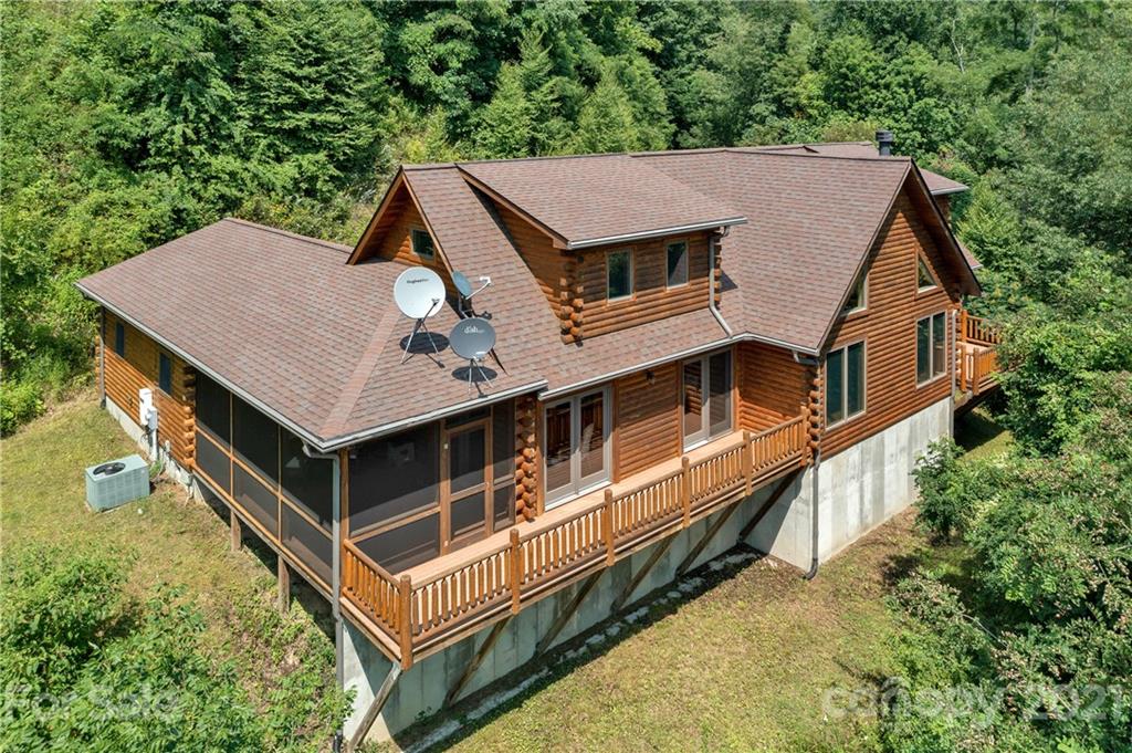 210 Angel Falls Road Clyde, NC 28721 - Photo 1 of 40 an aerial view of a house with a yard balcony and mountain view