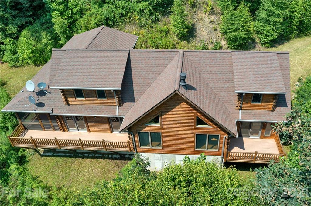 210 Angel Falls Road Clyde, NC 28721 - Photo 2 of 40 a aerial view of a house with a yard and balcony