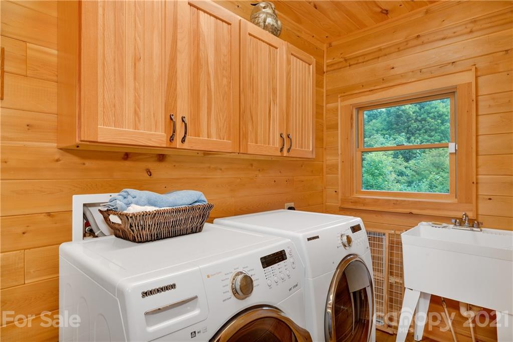 210 Angel Falls Road Clyde, NC 28721 - Photo 17 of 40 a utility room with dryer and washer