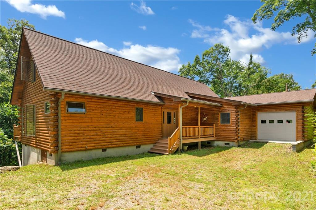 210 Angel Falls Road Clyde, NC 28721 - Photo 3 of 40 a front view of a house with a yard