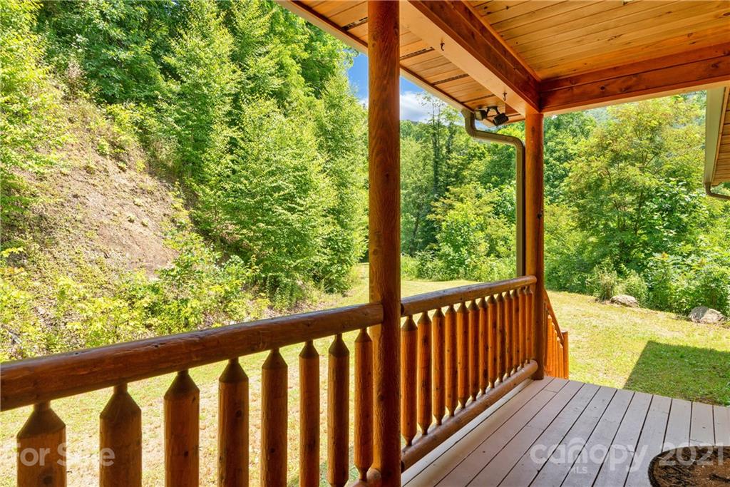 210 Angel Falls Road Clyde, NC 28721 - Photo 4 of 40 a view of balcony with wooden floor