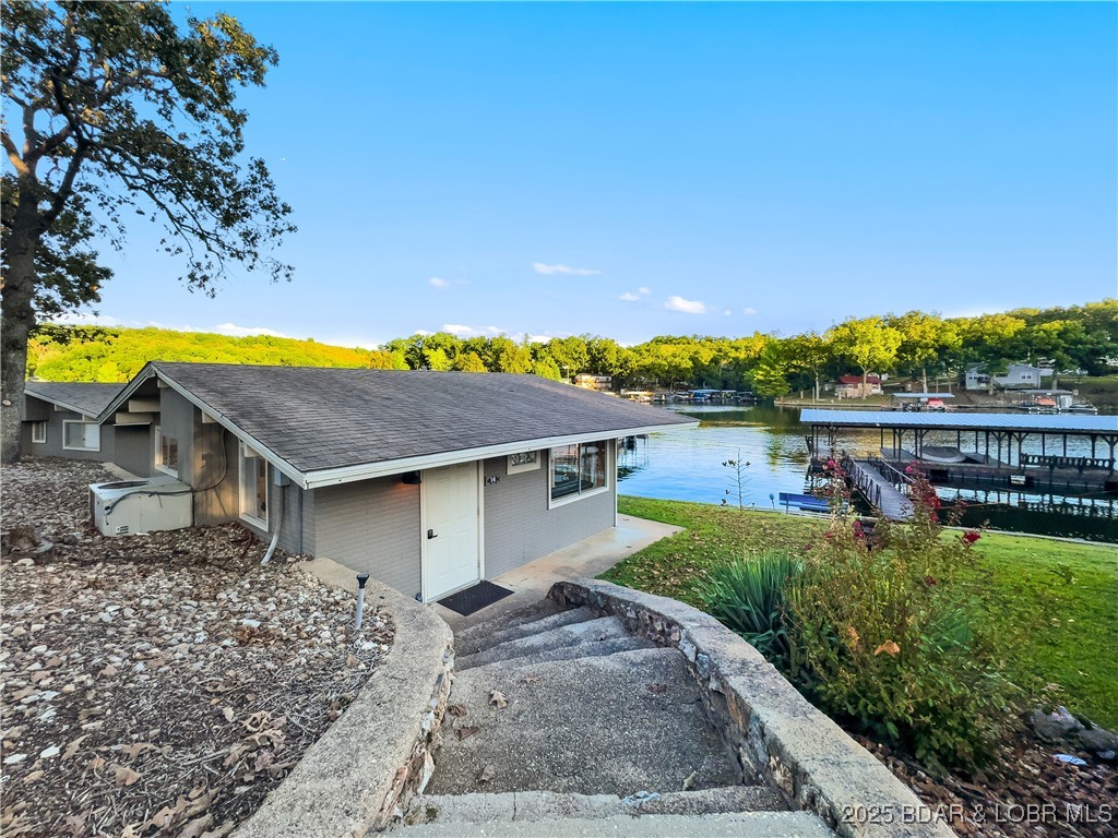33303 Bass Point Road, Unit 14 Sunrise Beach, MO 65079 - Photo 17 of 30 Side View of Cabin & Dock Slip