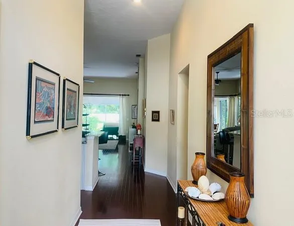 a view of a hallway and dining room