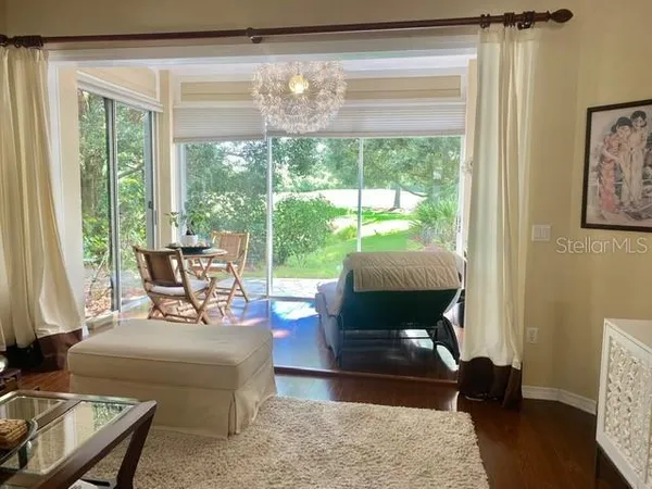 a living room with furniture and a window