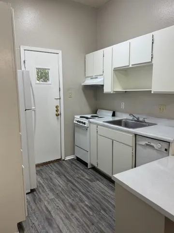 a kitchen with a sink a stove and refrigerator