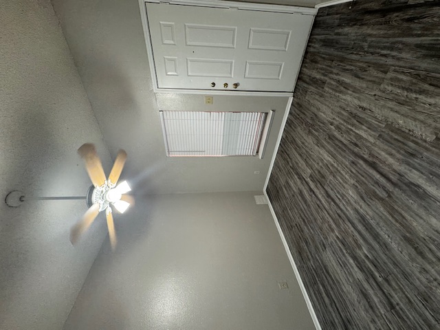 4608 Bennett Avenue, Unit 106 Austin, TX 78751 - Photo 6 of 9 an empty room with wooden floor and windows