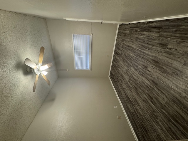 4608 Bennett Avenue, Unit 106 Austin, TX 78751 - Photo 8 of 9 an empty room with wooden floor and windows