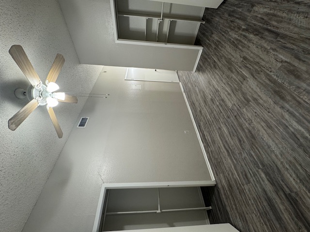 4608 Bennett Avenue, Unit 106 Austin, TX 78751 - Photo 9 of 9 an empty room with wooden floor a ceiling fan and closet