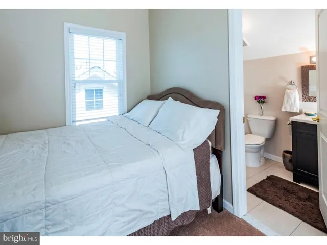 a bathroom with a sink toilet and mirror