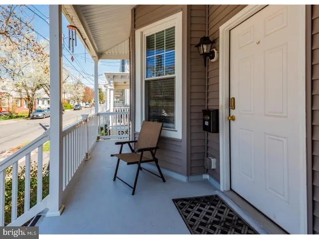 a view of a balcony with chair and table