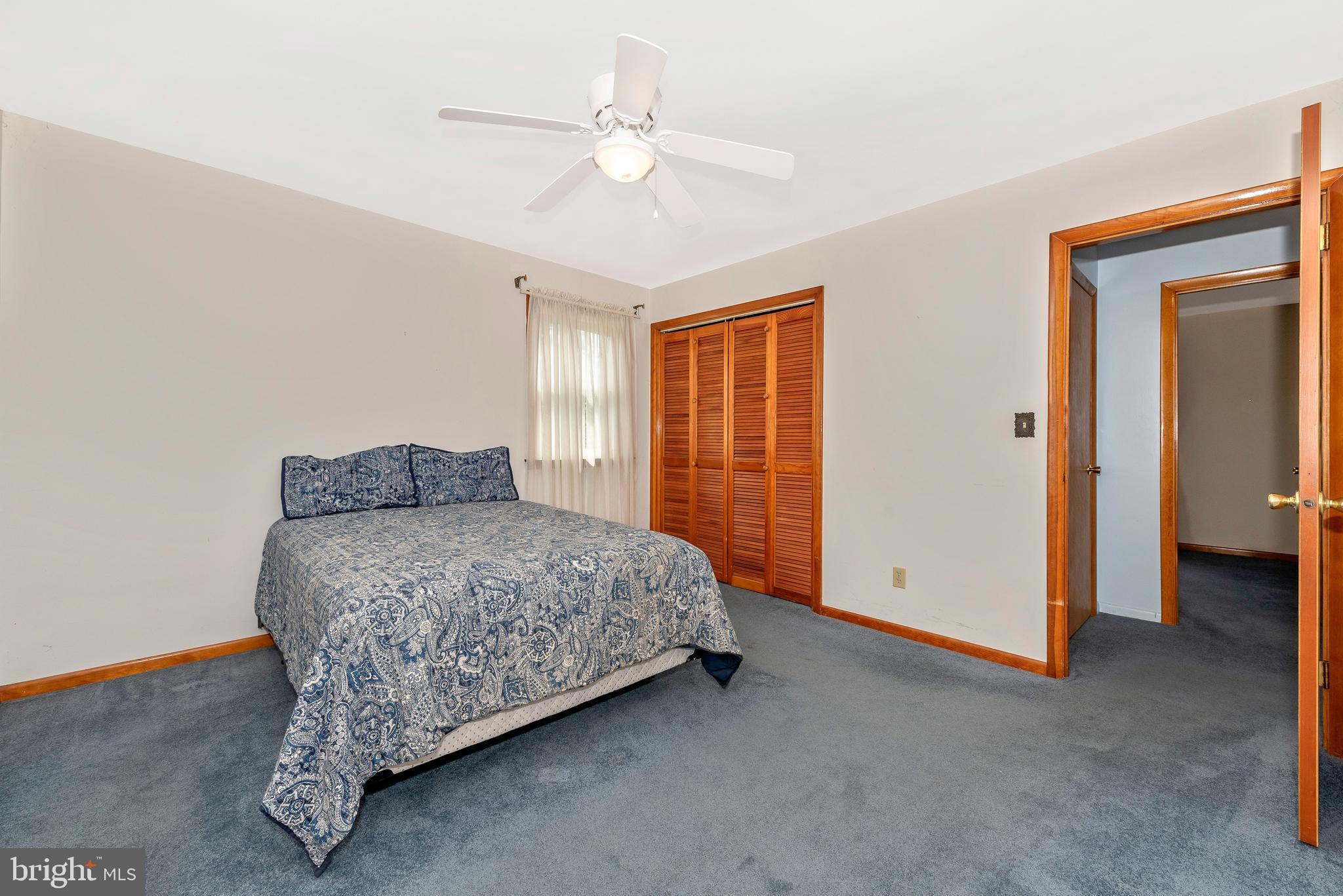 4210 Middleburg Road Union Bridge, MD 21791 - Photo 11 of 39 a spacious bedroom with a bed and a chandelier