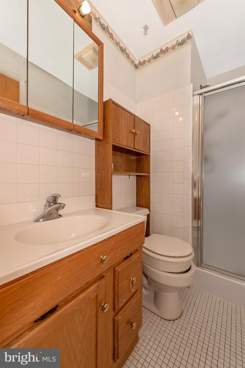 4210 Middleburg Road Union Bridge, MD 21791 - Photo 13 of 39 a bathroom with a sink a toilet and shower