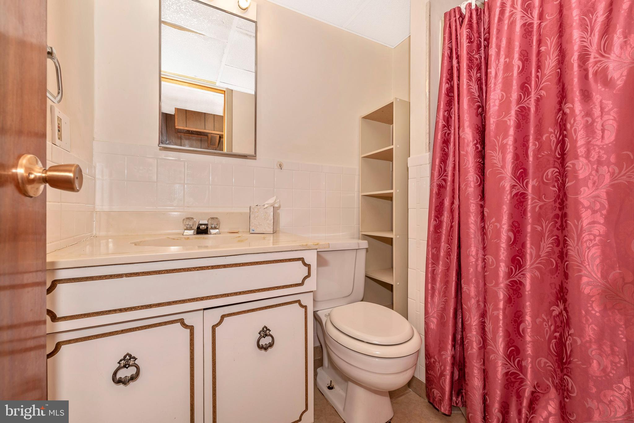 4210 Middleburg Road Union Bridge, MD 21791 - Photo 27 of 39 a bathroom with a sink a toilet and shower curtain