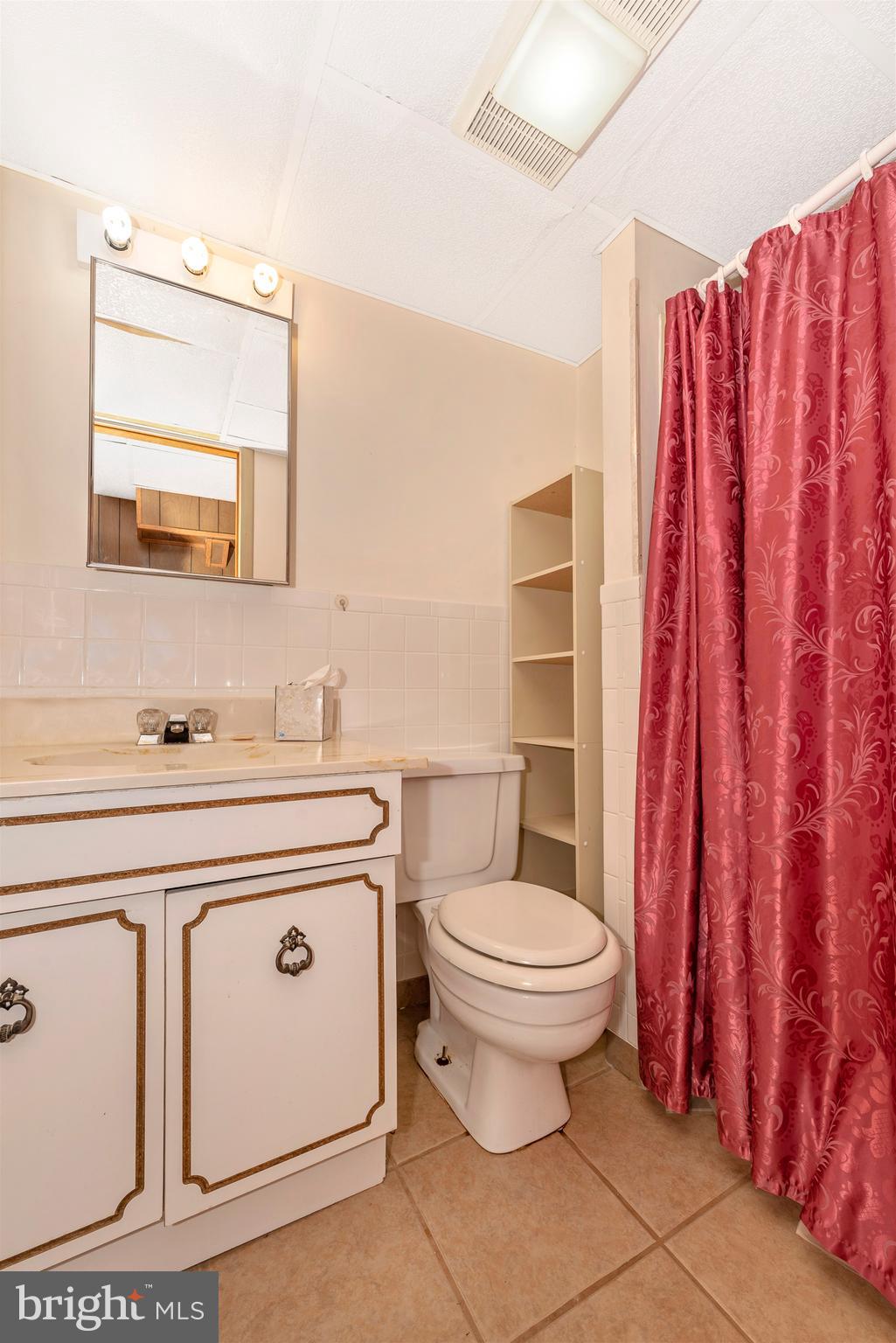 4210 Middleburg Road Union Bridge, MD 21791 - Photo 28 of 39 a bathroom with a sink a toilet and a mirror