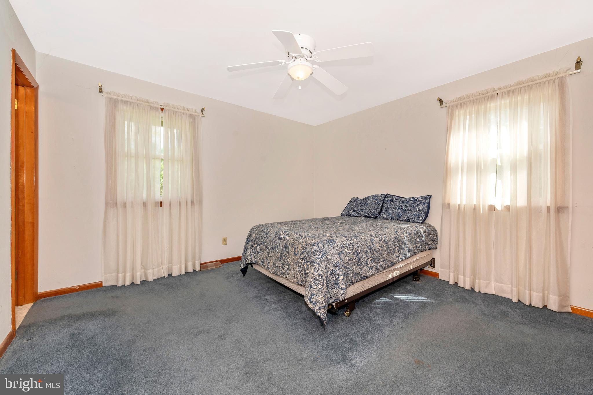 4210 Middleburg Road Union Bridge, MD 21791 - Photo 10 of 39 a spacious bedroom with a bed and a window