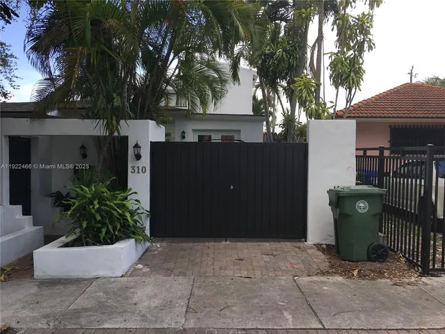 a view of a potted plants in front of a house