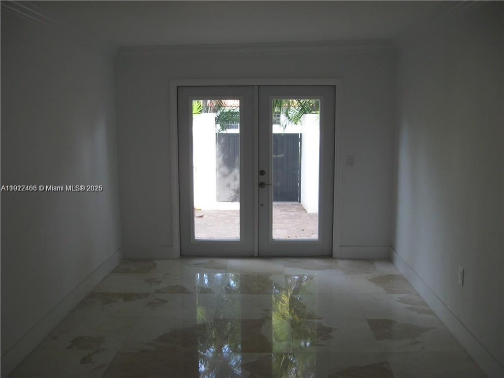 310 Southwest 34th Avenue Miami, FL 33135 - Photo 4 of 19 an empty room with windows