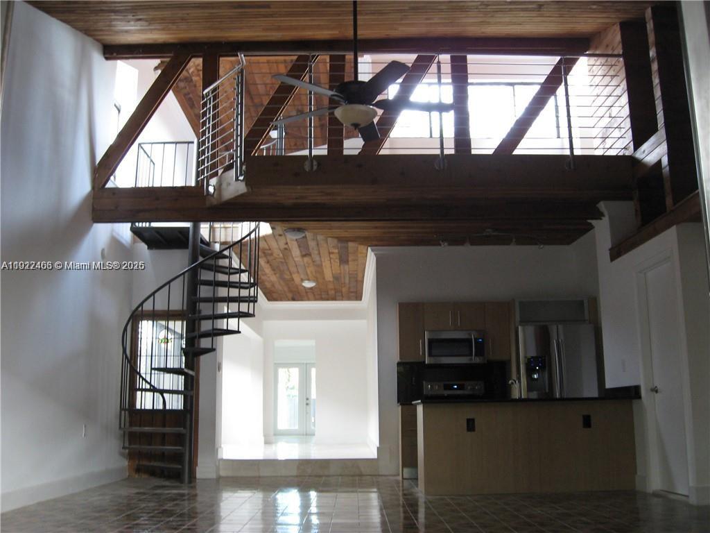310 Southwest 34th Avenue Miami, FL 33135 - Photo 7 of 19 a view of entryway and hall with wooden floor