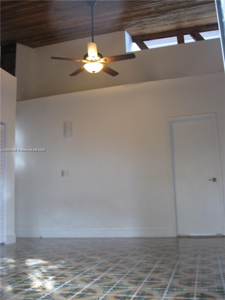 310 Southwest 34th Avenue Miami, FL 33135 - Photo 8 of 19 a view of a room with wooden floor