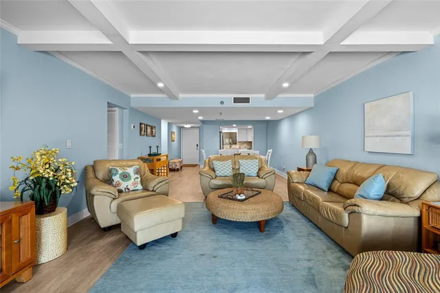 a living room with furniture and flowers