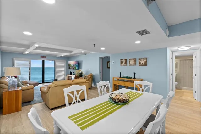 a bedroom with two beds and a dresser