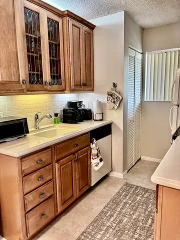 a view of kitchen with kitchen island a dining table chairs and a stove