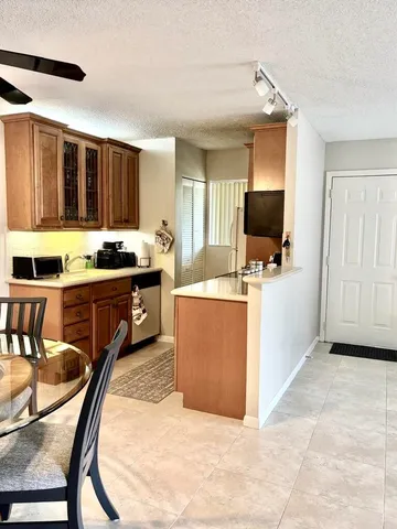 a kitchen with a stove and a microwave