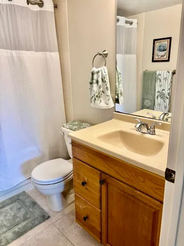 a bathroom with a shower curtain