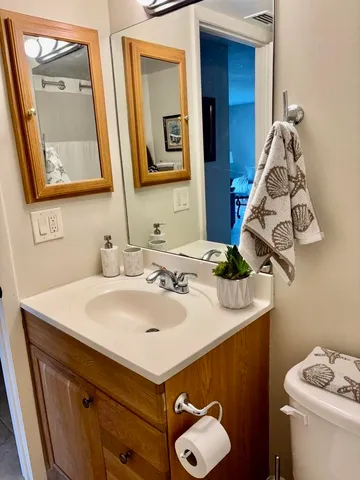 a bathroom with a shower and a sink