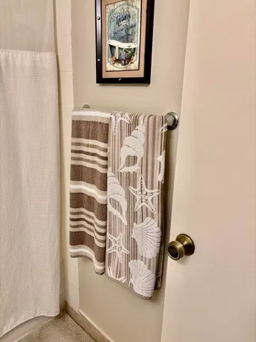 a view of a room with wooden floor and cabinet