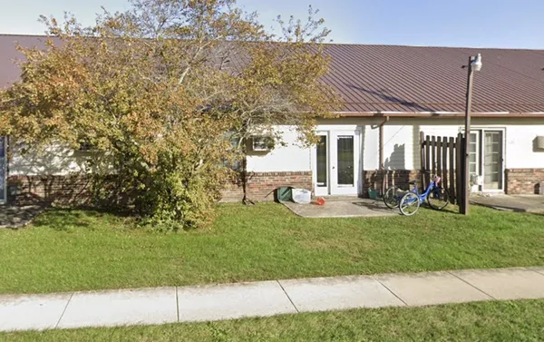 a front view of a house with a yard