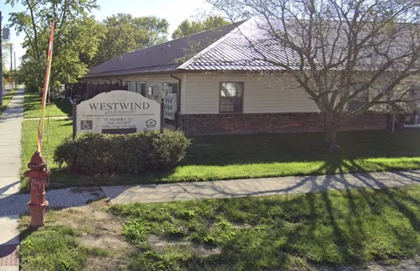 a view of a house with a yard and a garden